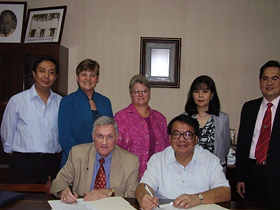 The signing of the Memorandum of Agreement for the International Nursing Program with then Alderson-Broaddus College President Stephen Markwood and AU Chairman Francisco Cayco.